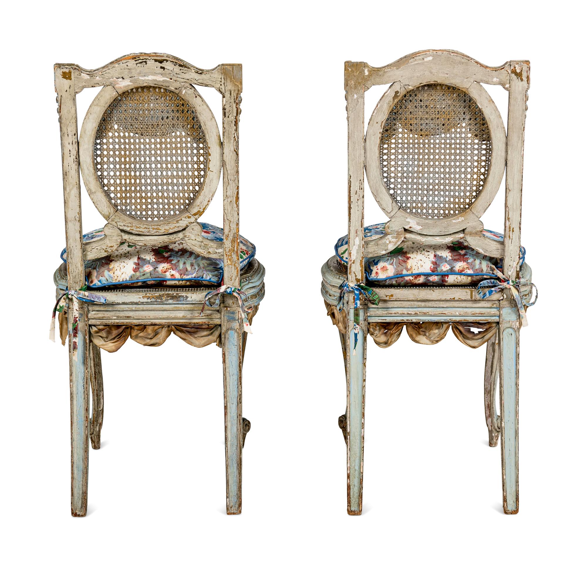 A Pair of Louis XVI Style Painted and Parcel-Gilt Chaises