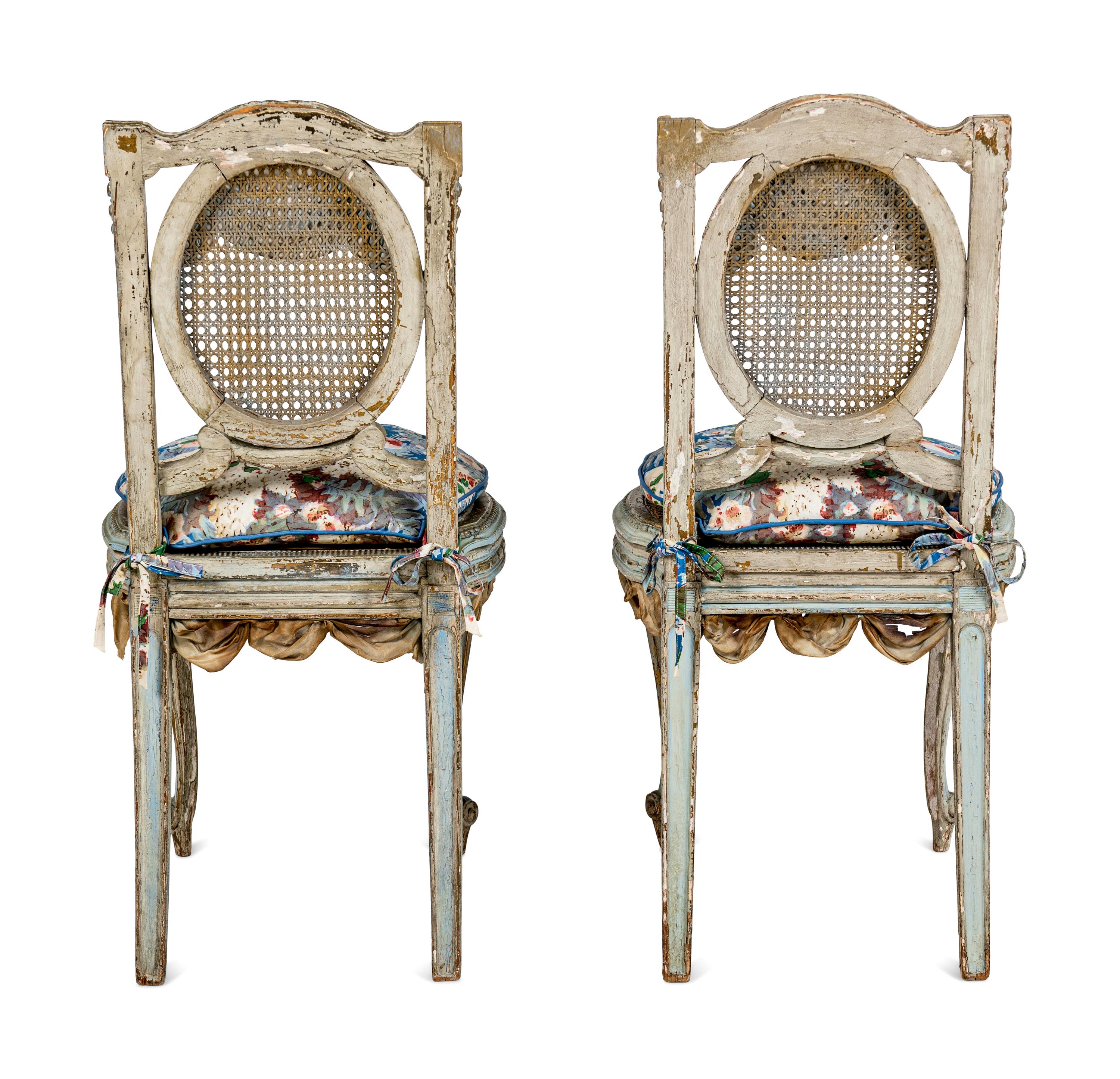 A Pair of Louis XVI Style Painted and Parcel-Gilt Chaises