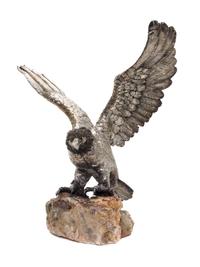 An Italian Silver Model of an Eagle, Manner of Buccellati, Florence, 20th Century, with outstretched wings, on a rock base.