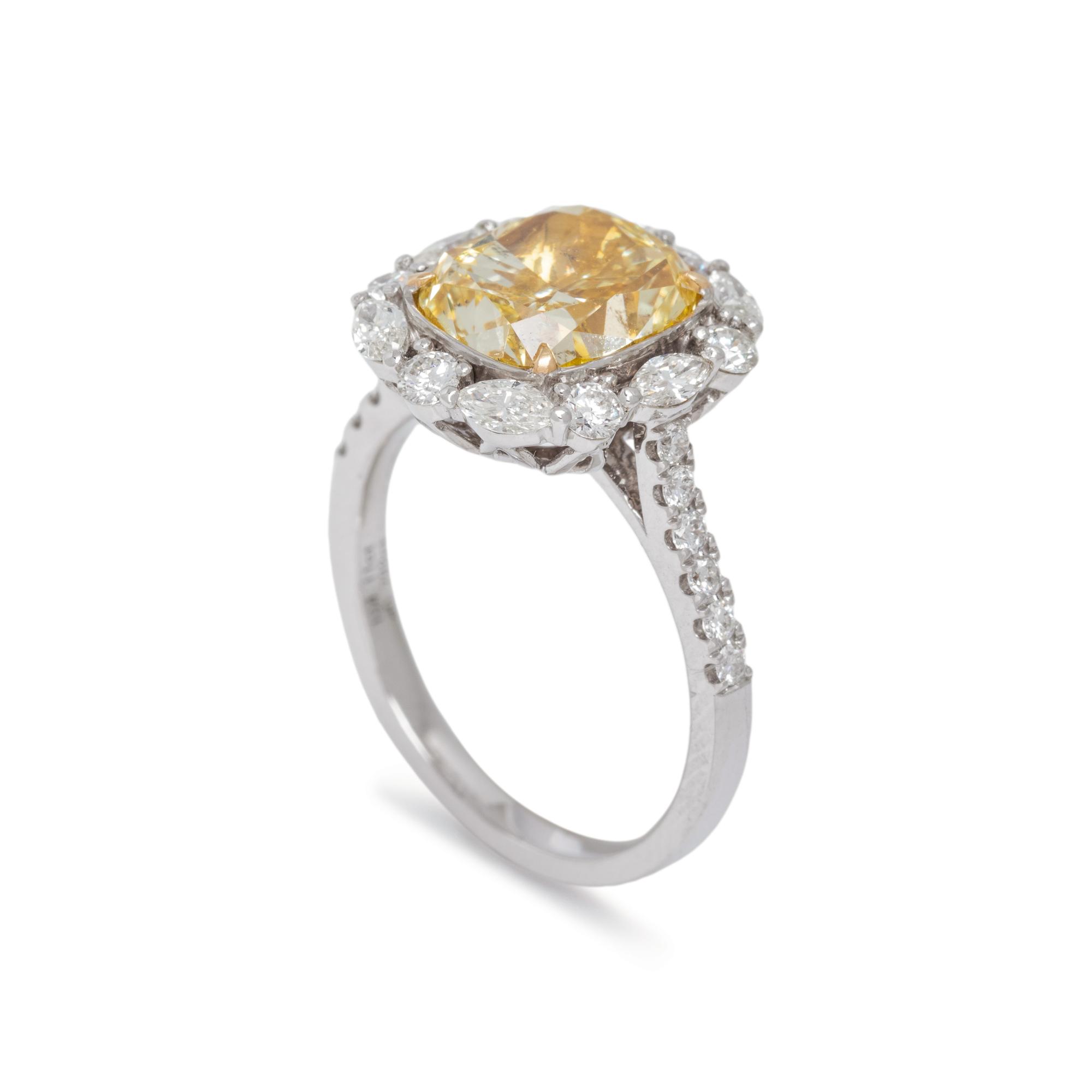 FANCY YELLOW DIAMOND AND DIAMOND RING