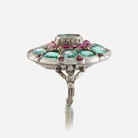 A green beryl, ruby, and ten karat white gold ring