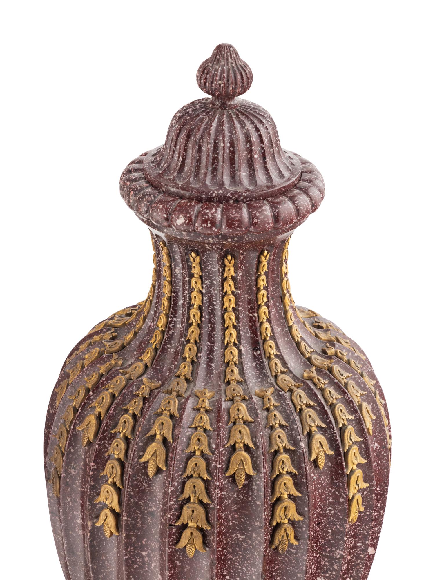 A Pair of Ormolu Mounted Porphyry Urns
