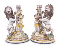 A Pair of French Faience Lion Ornaments