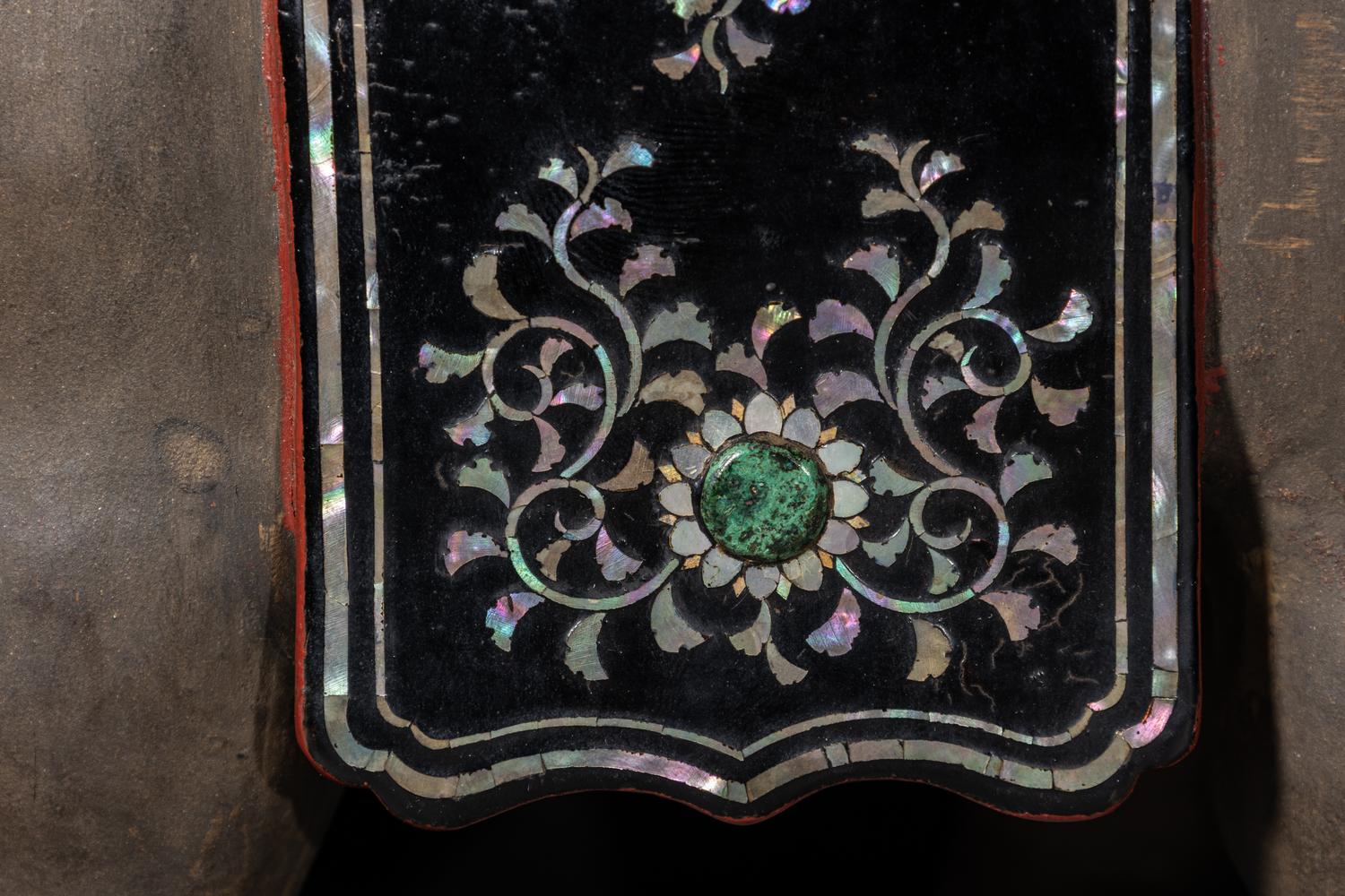A Japanese Mother-of-Pearl Inlaid Lacquered Wood Okimono of an Elephant
