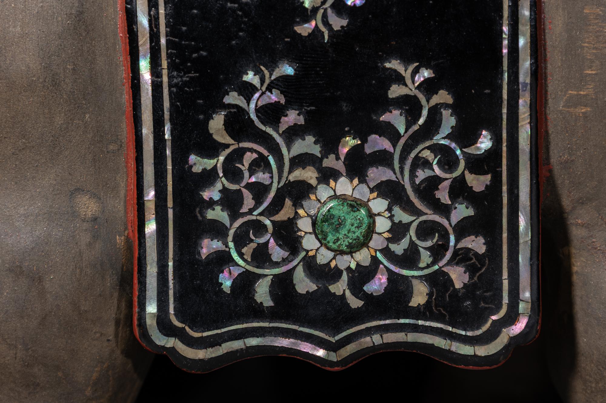 A Japanese Mother-of-Pearl Inlaid Lacquered Wood Okimono of an Elephant
