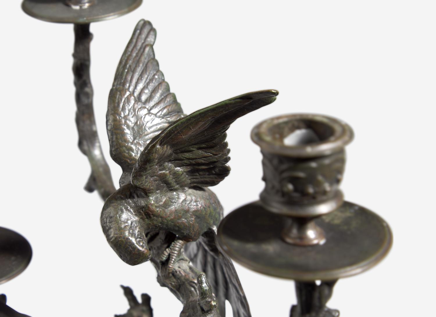 A Pair of Patinated Bronze Animalier Four-Light Candelabra