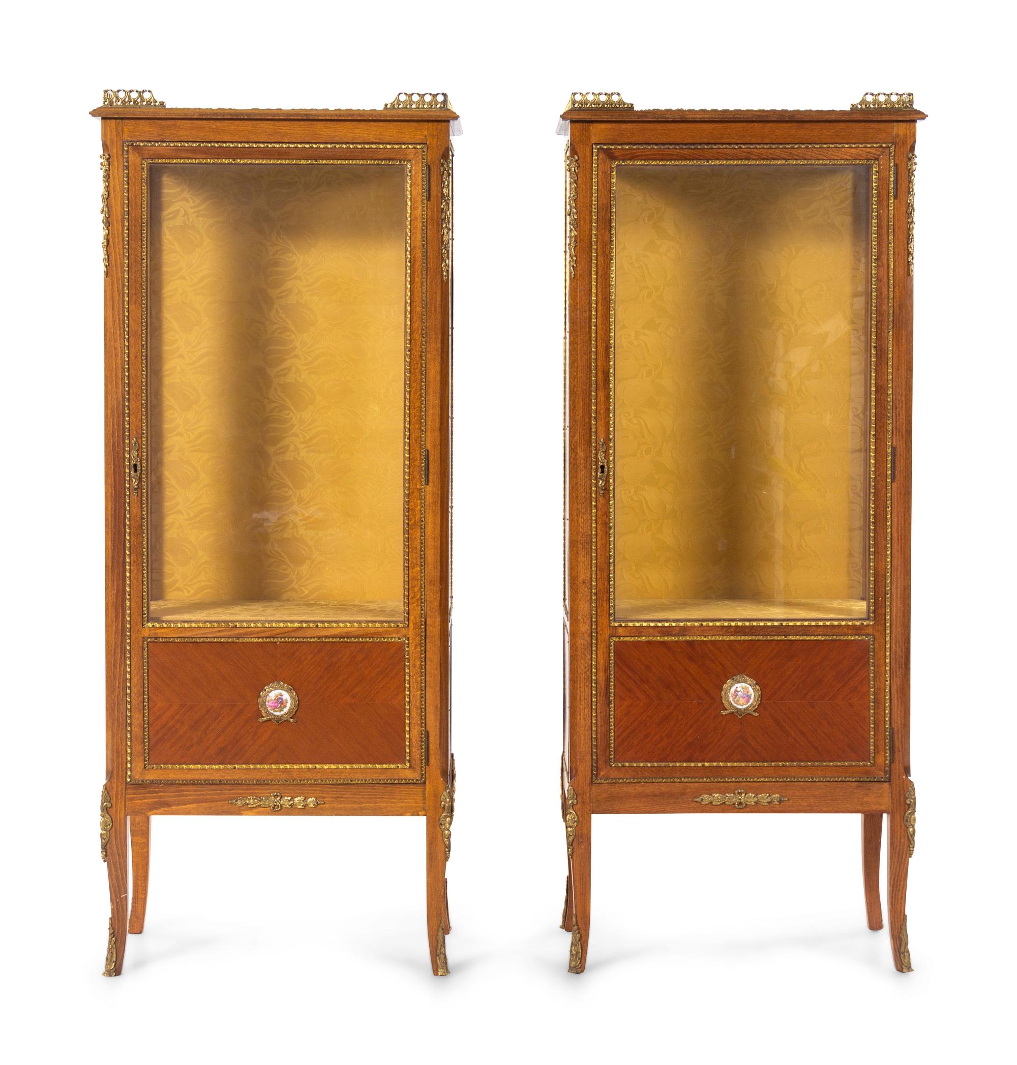 A Pair of Louis XVI Style Gilt Metal and Porcelain Mounted Vitrine Cabinets