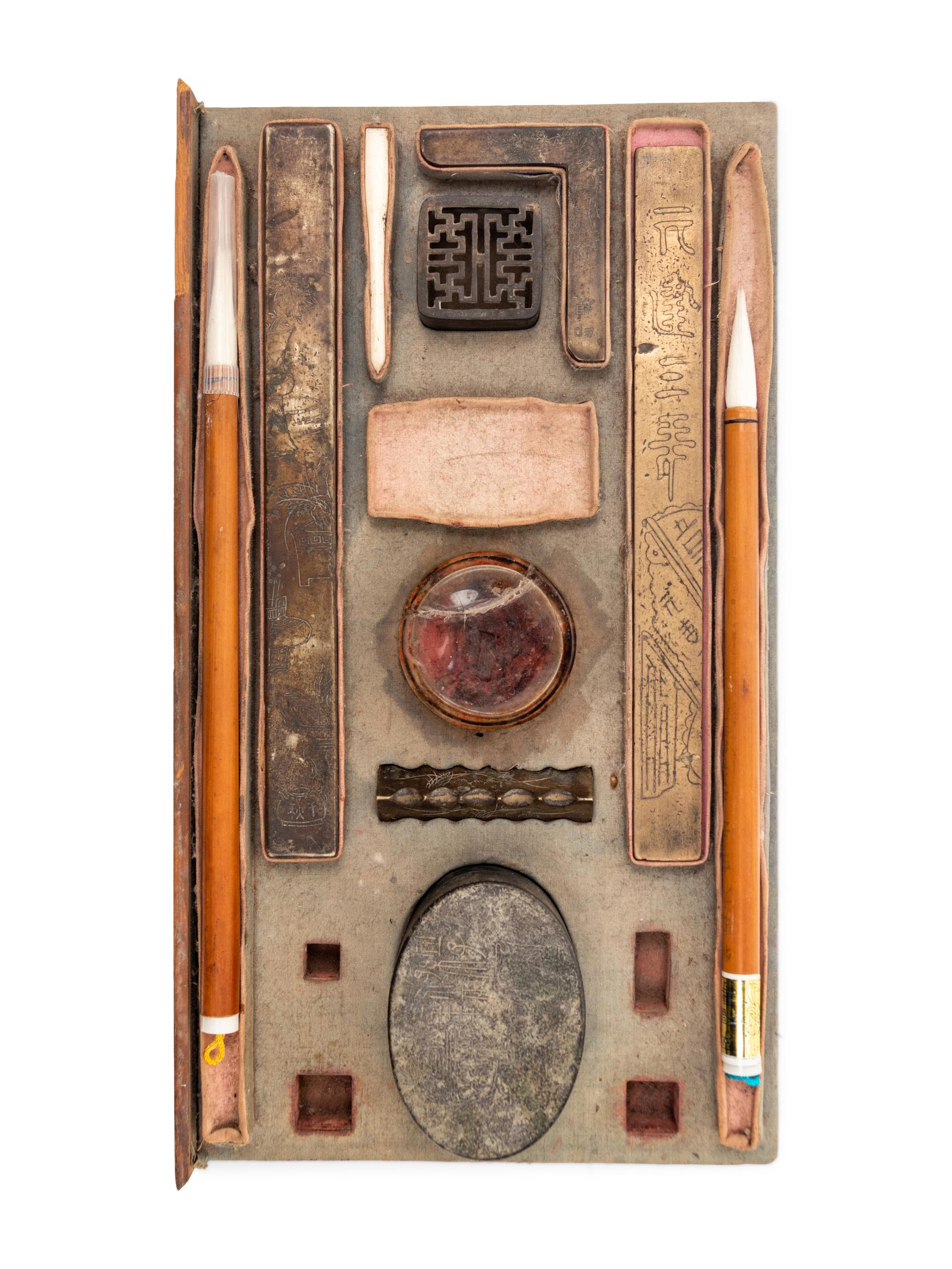 A Chinese Scholar's Calligraphy Set and Three Inkstones