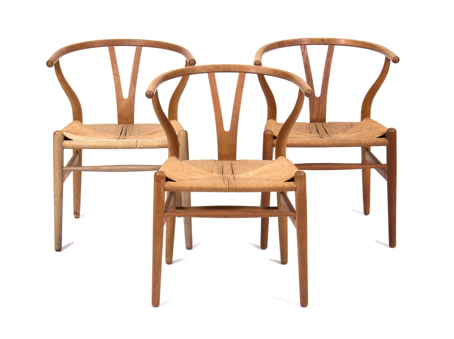 Three Hans Wegner Oak Armchairs Height 28 3/4 inches. — 20TH CENTURY