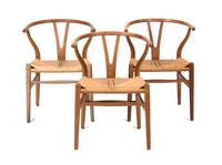 Three Hans Wegner Oak Armchairs Height 28 3/4 inches. — 20TH CENTURY