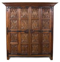 A Northern European Gothic Carved Oak Armoire Height 86 1/2 x length 51 1/2 x depth 32 1/2 inches. — POSSIBLY RHINELAND OR FLANDERS, CIRCA 1530