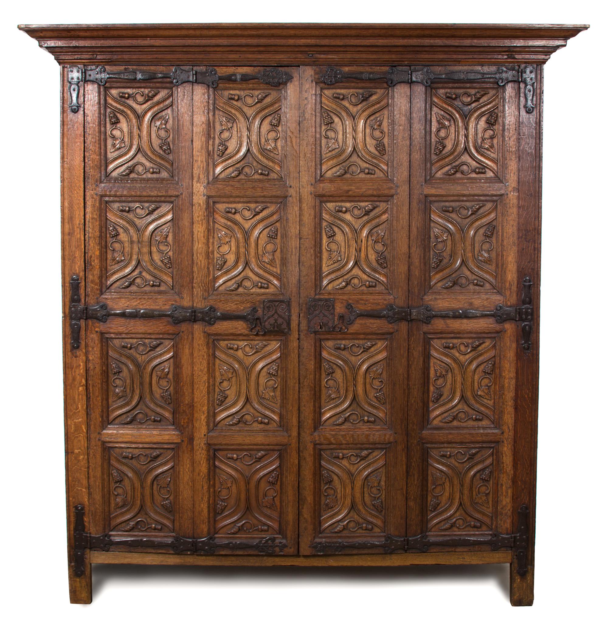 A Northern European Gothic Carved Oak Armoire Height 86 1/2 x length 51 1/2 x depth 32 1/2 inches. — POSSIBLY RHINELAND OR FLANDERS, CIRCA 1530