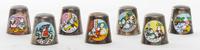 Seven Downs Enameled Silver-plate Thimbles Height of first 7/8 inch.