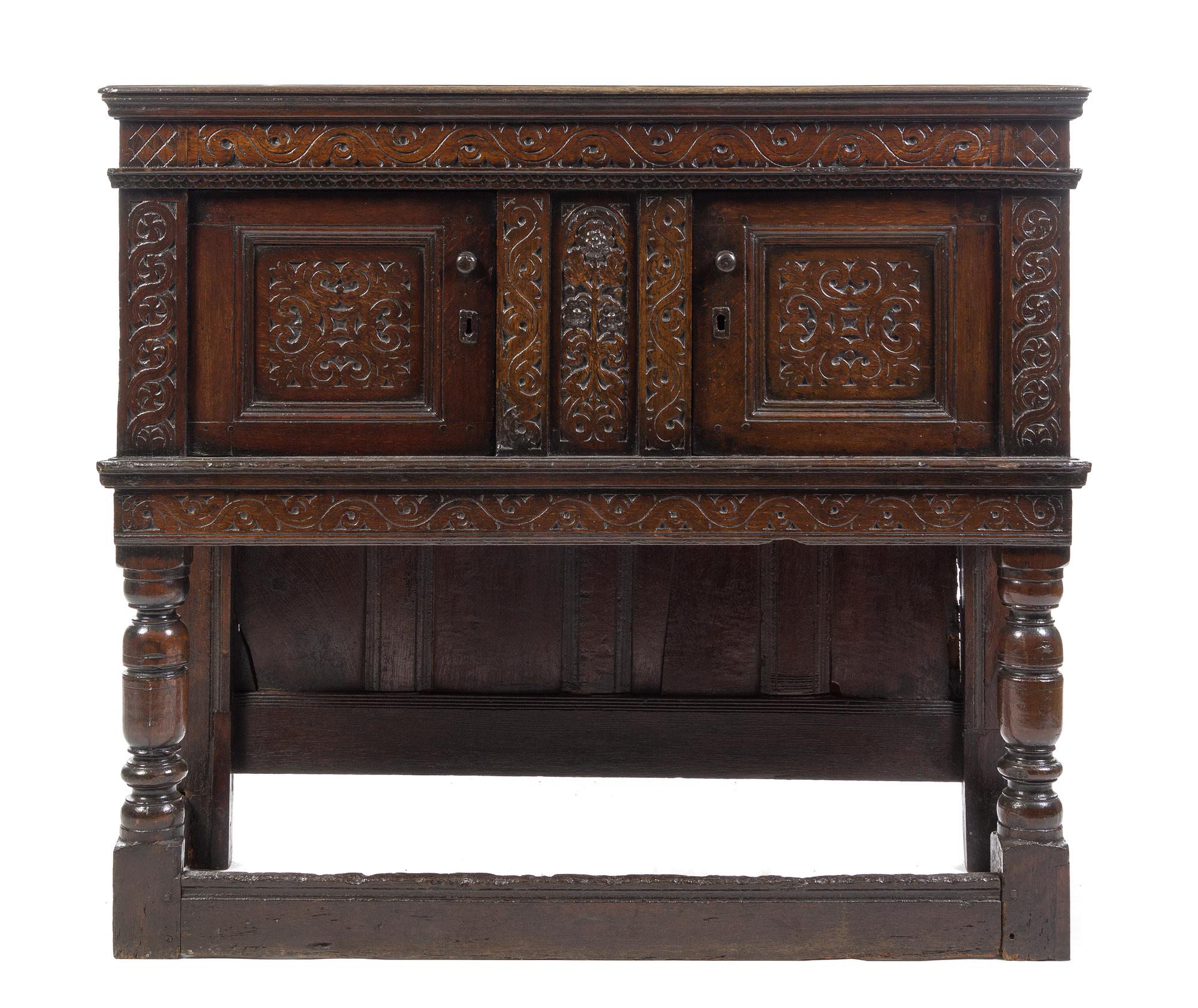 An English Carved Oak Court Cupboard Height 44 x width 50 1/4 x depth 19 inches. — 17TH CENTURY WITH LATER ELEMENTS