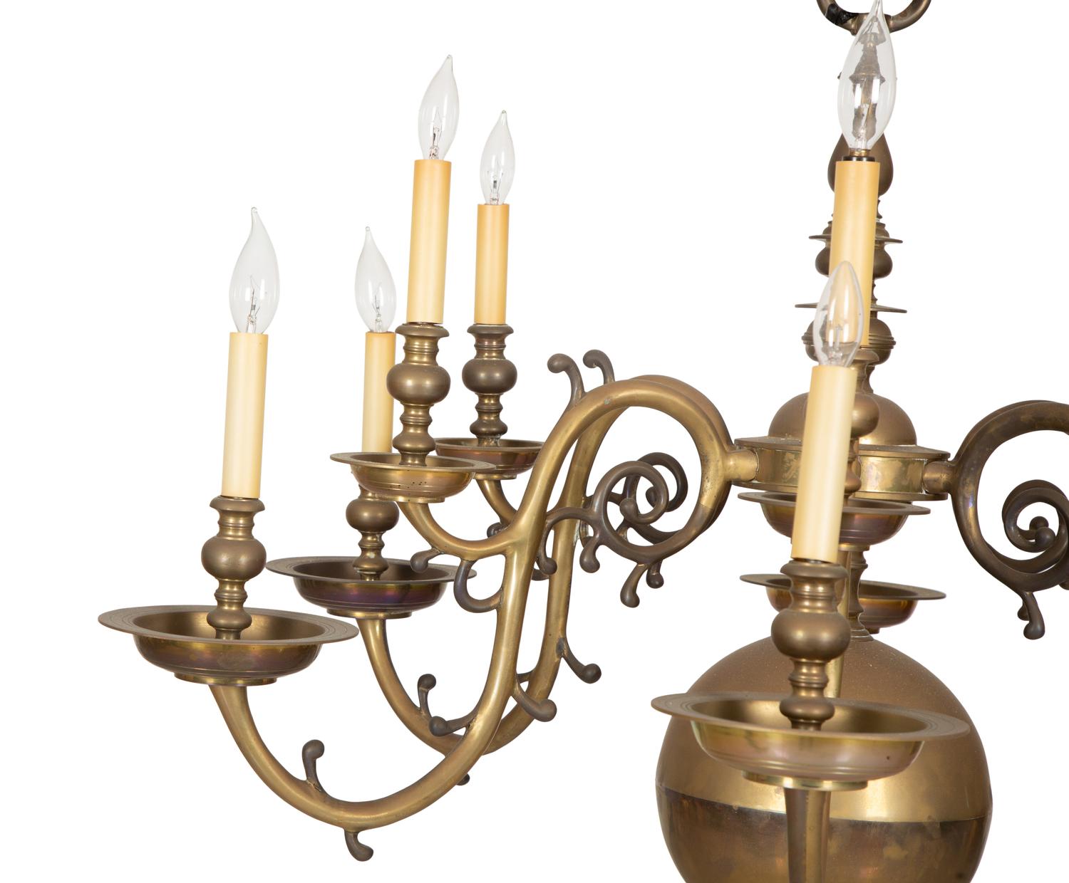 A Baroque Style Brass Twelve-Light Chandelier