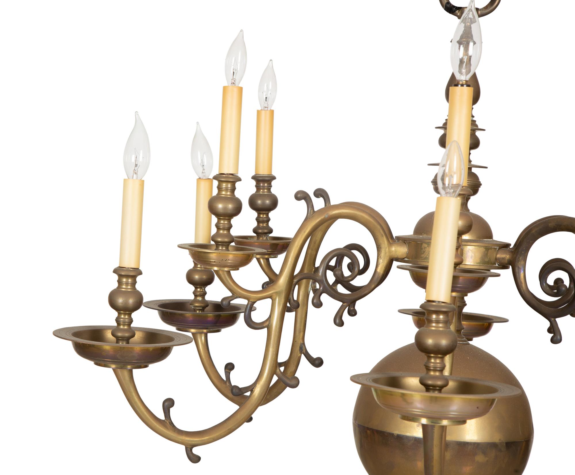 A Baroque Style Brass Twelve-Light Chandelier