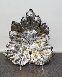 A Continental Silver Dish, maker's marks obscured, in the form of a leaf.
