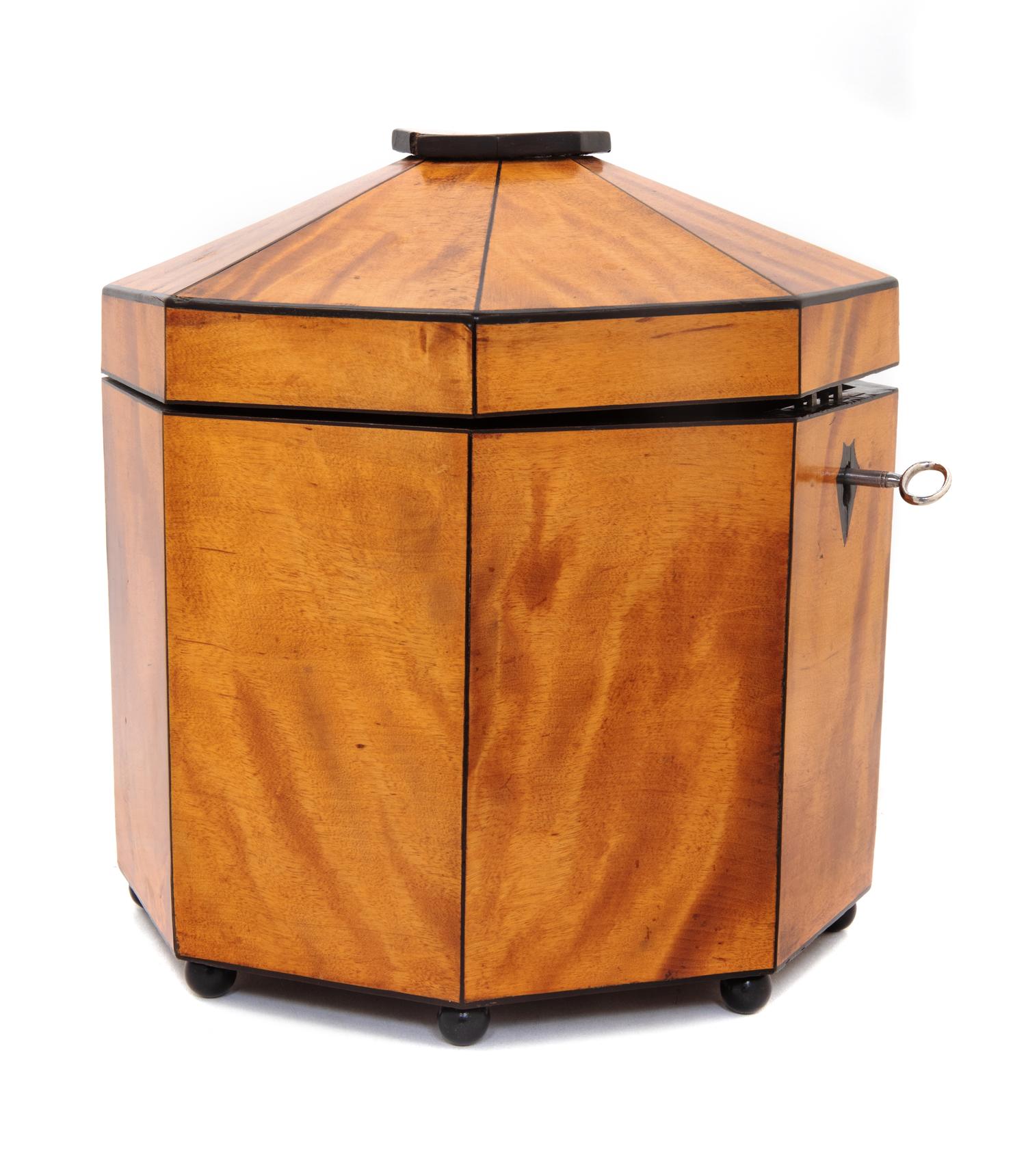 A Biedermeier Ebony Banded Satinwood Octagonal Tea Caddy