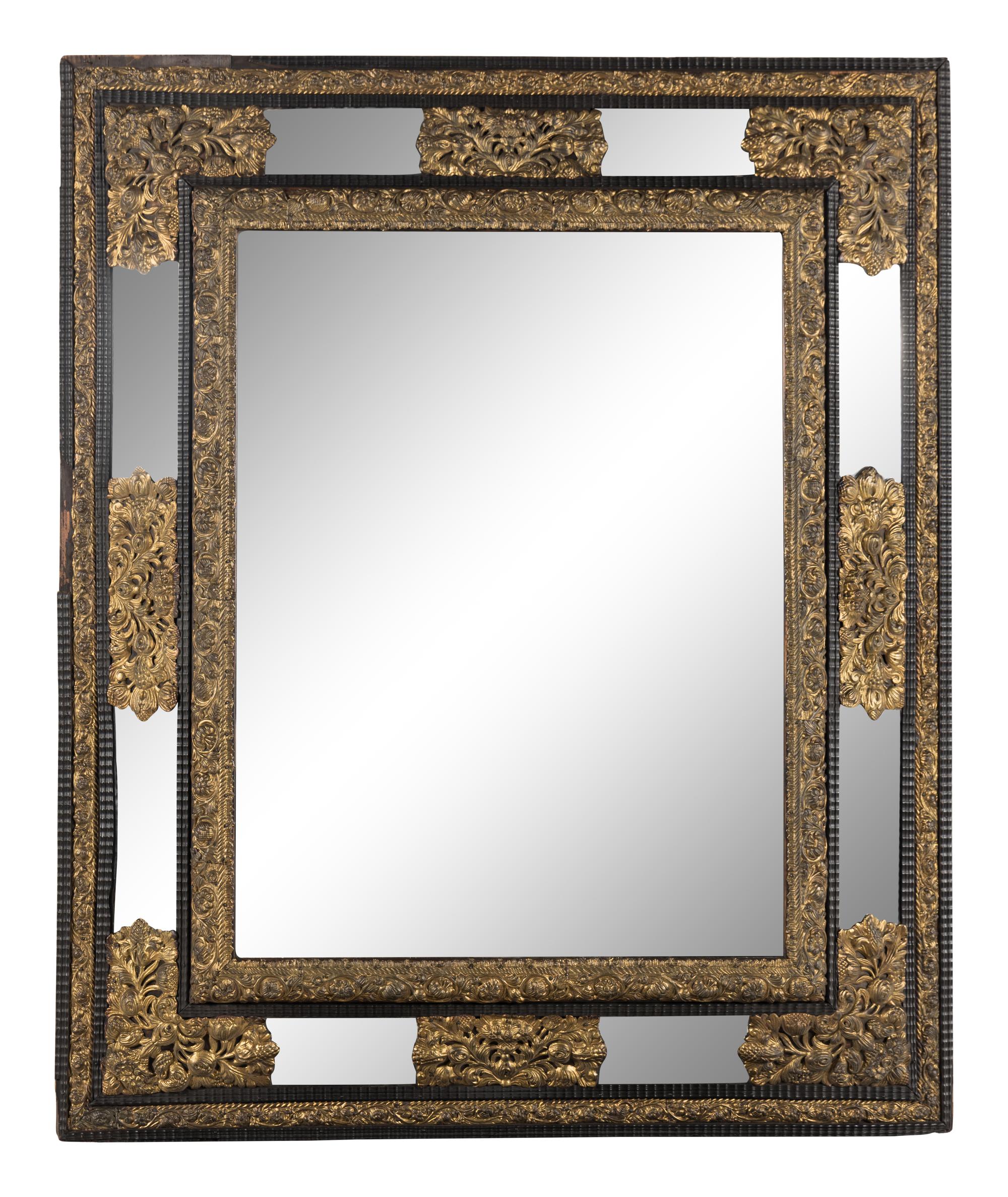 A Dutch Pressed Brass and Part Ebonized Mirror