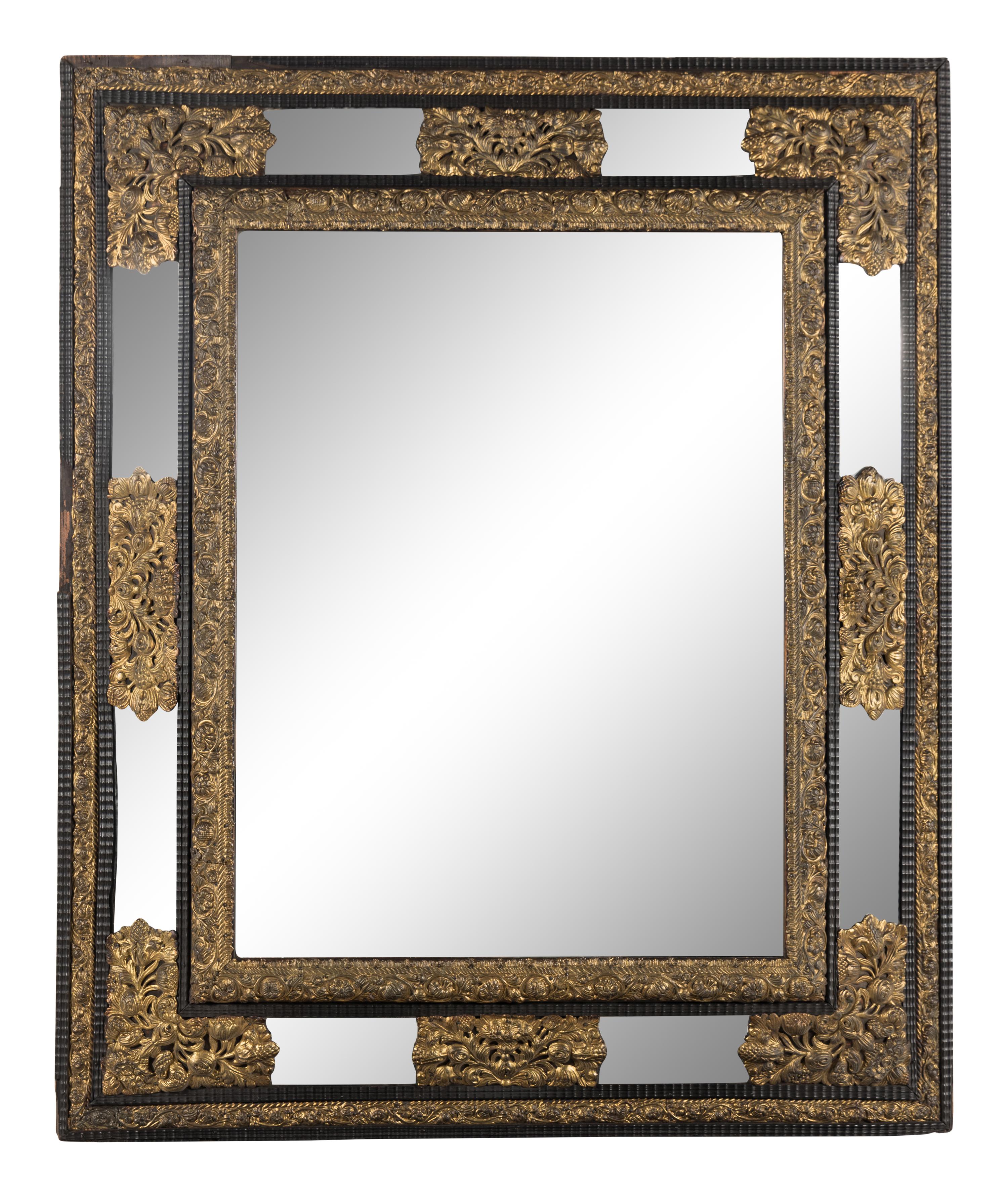 A Dutch Pressed Brass and Part Ebonized Mirror