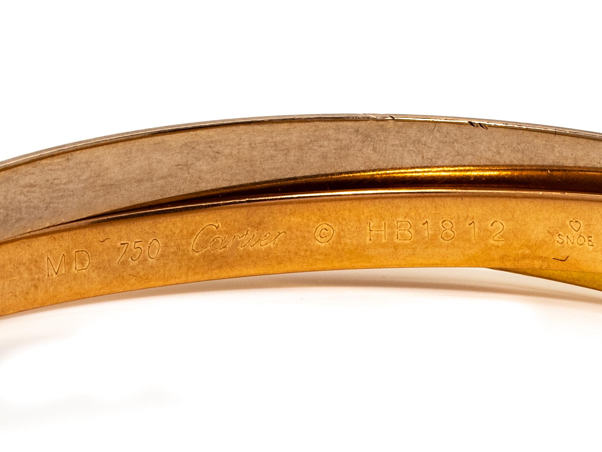 CARTIER, TRICOLOR GOLD 'TRINITY' BANGLE BRACELET