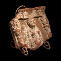 An Egyptian Terracotta Fragment with Concubine Flanked by Bes-Shaped Columns