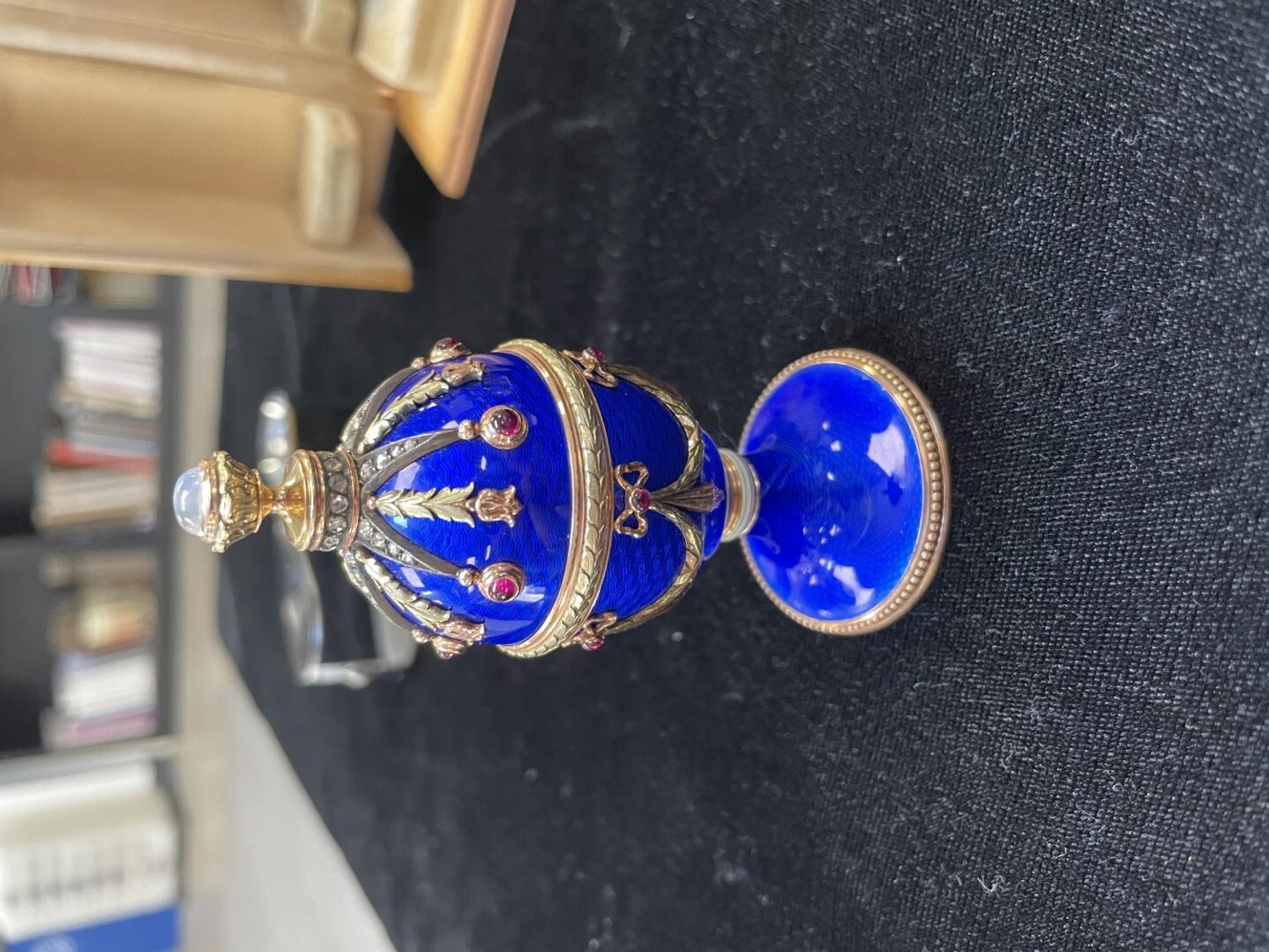 A 14 Karat Vari-Color Gold, Guilloché Enamel, Diamond, and Cabochon Jewel-Mounted Egg-Form Perfume and a Related Guilloché Enamel, 14 Karat Vari-Color Gold, Diamond, and Cabochon-Mounted Surprise Egg
