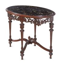 An Italian Carved Walnut Marble-Top Table