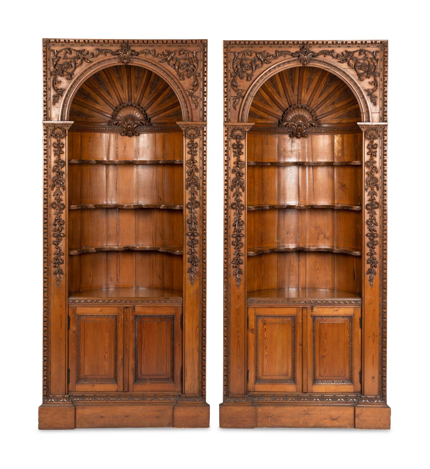 A Pair of English Carved Pine Cupboards