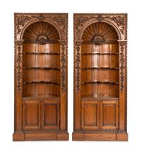 A Pair of English Carved Pine Cupboards