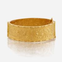 A gold bangle bracelet