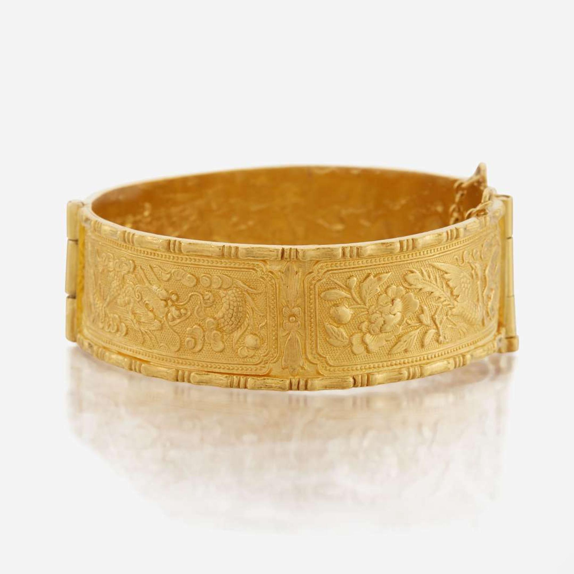 A gold bangle bracelet