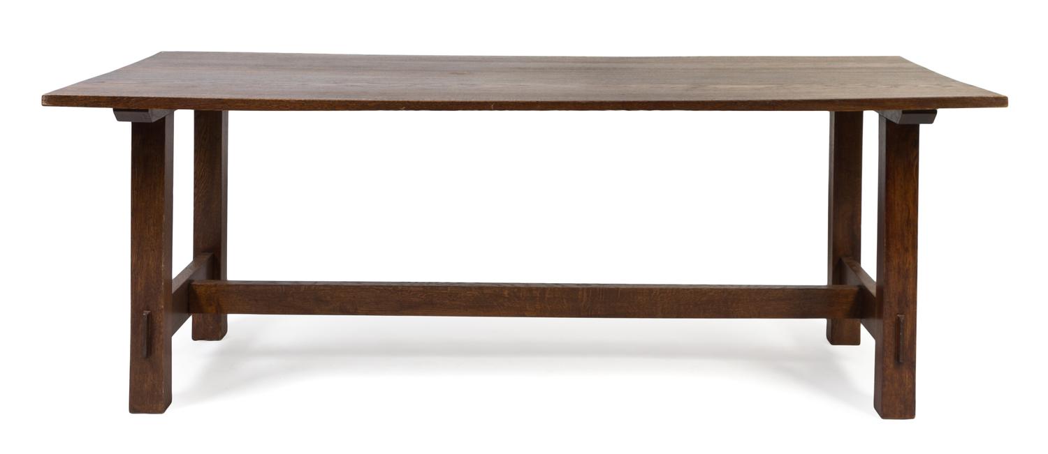 An American Arts and Crafts Oak Dining Table Height 30 x length 83 x depth 34 1/2 inches.