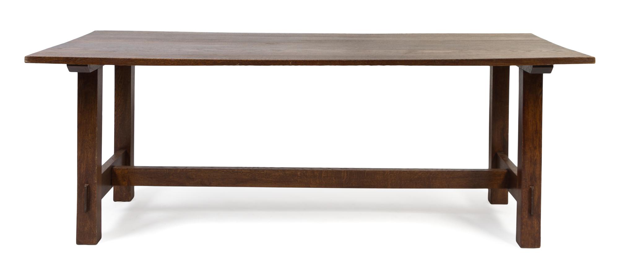 An American Arts and Crafts Oak Dining Table Height 30 x length 83 x depth 34 1/2 inches.