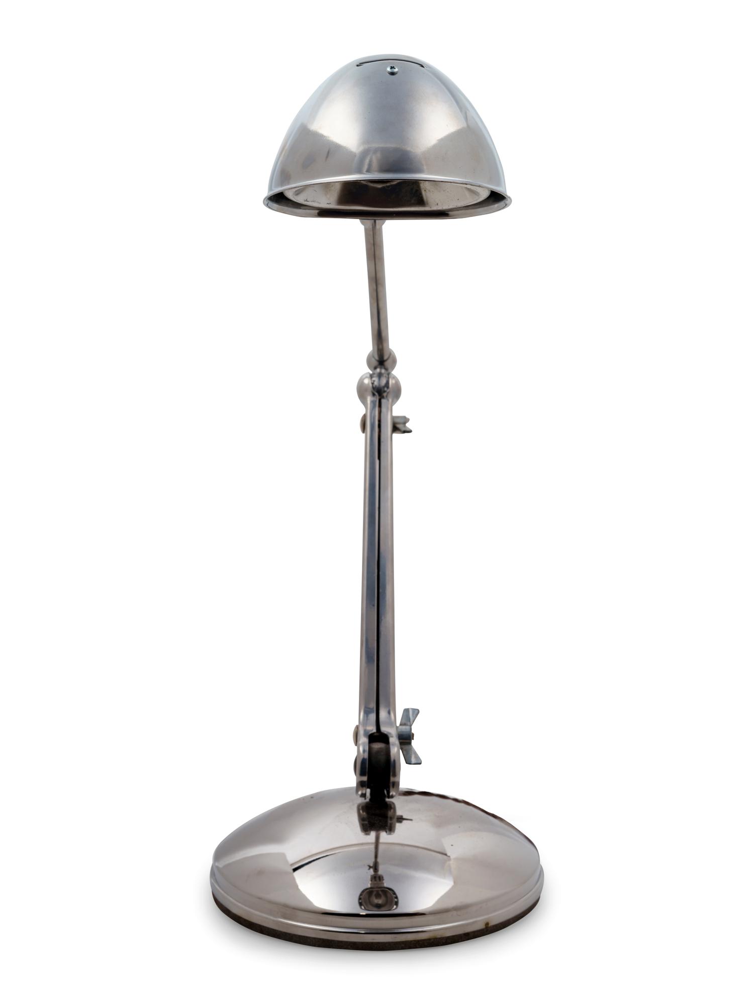 A Chromed Metal Articulated Desk Lamp