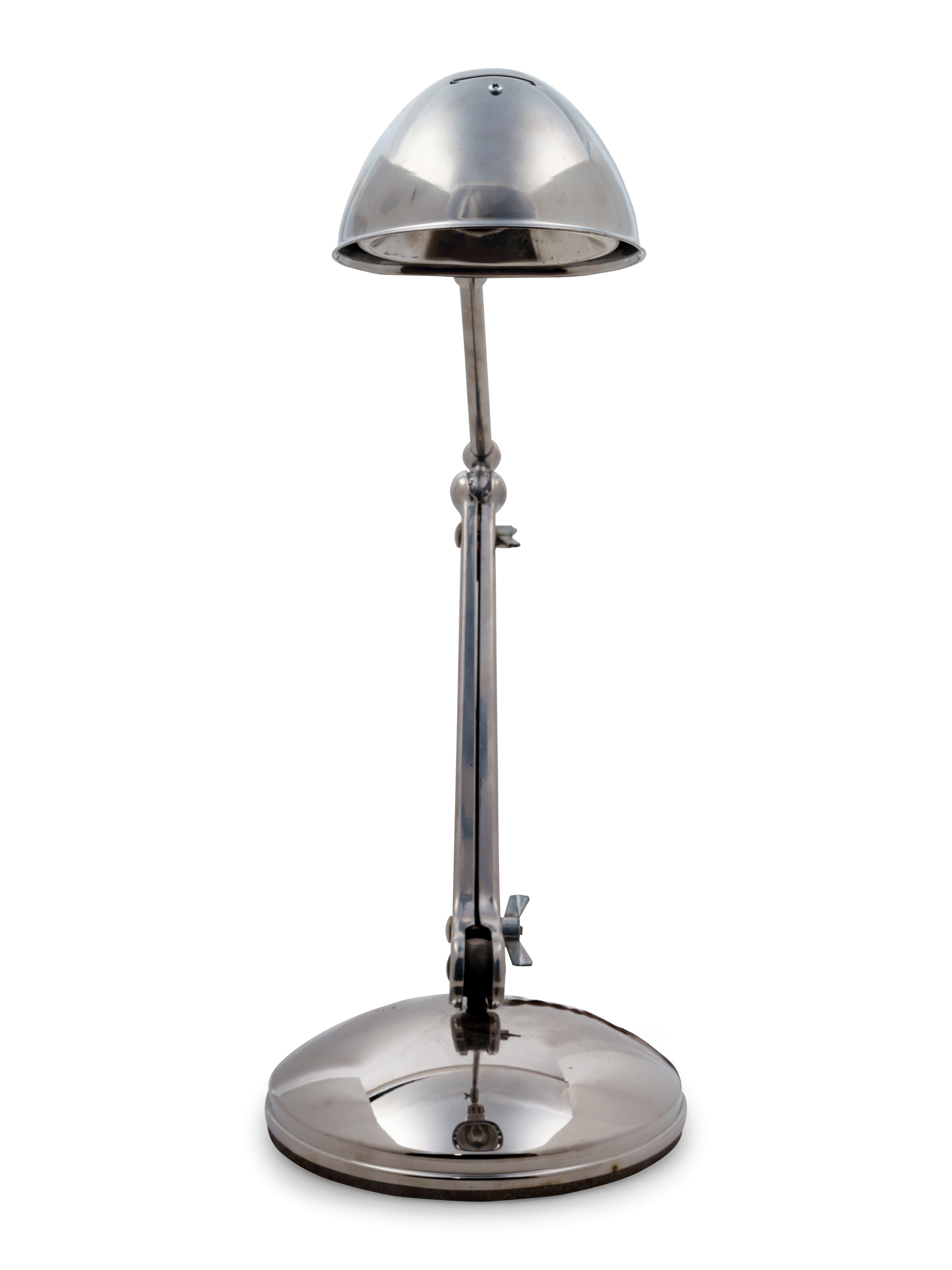 A Chromed Metal Articulated Desk Lamp