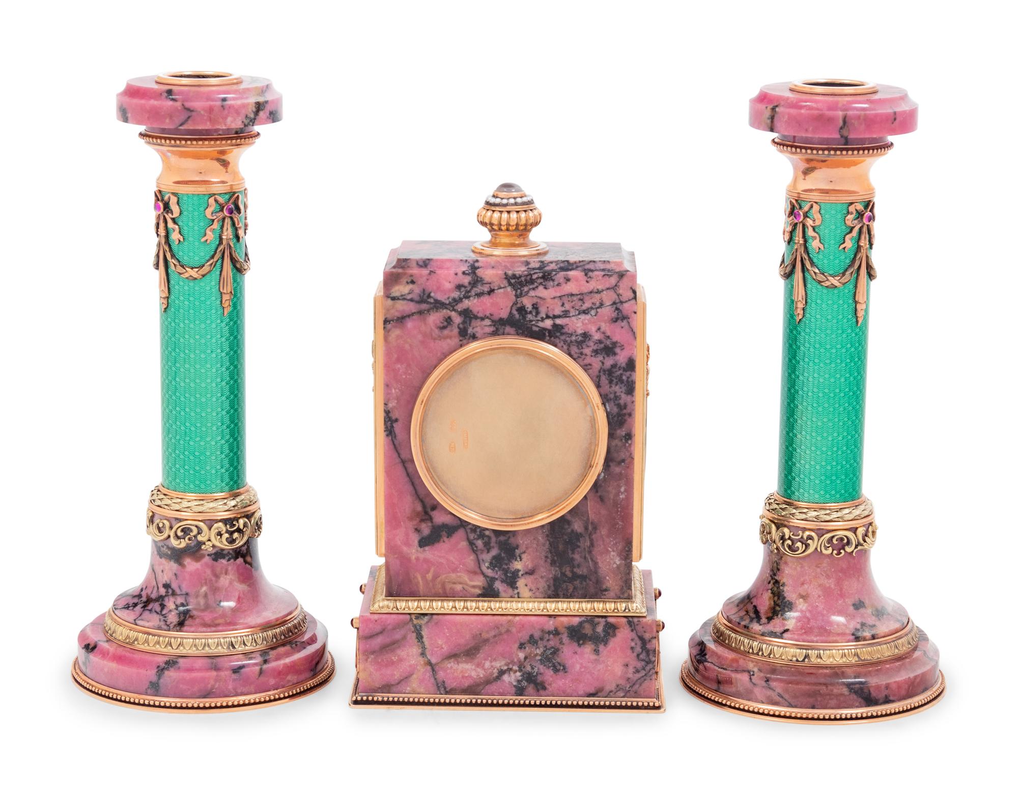 A Carved Hardstone, Enamel, 14-Karat Gold and Hardstone Mounted Three-Piece Clock Garniture