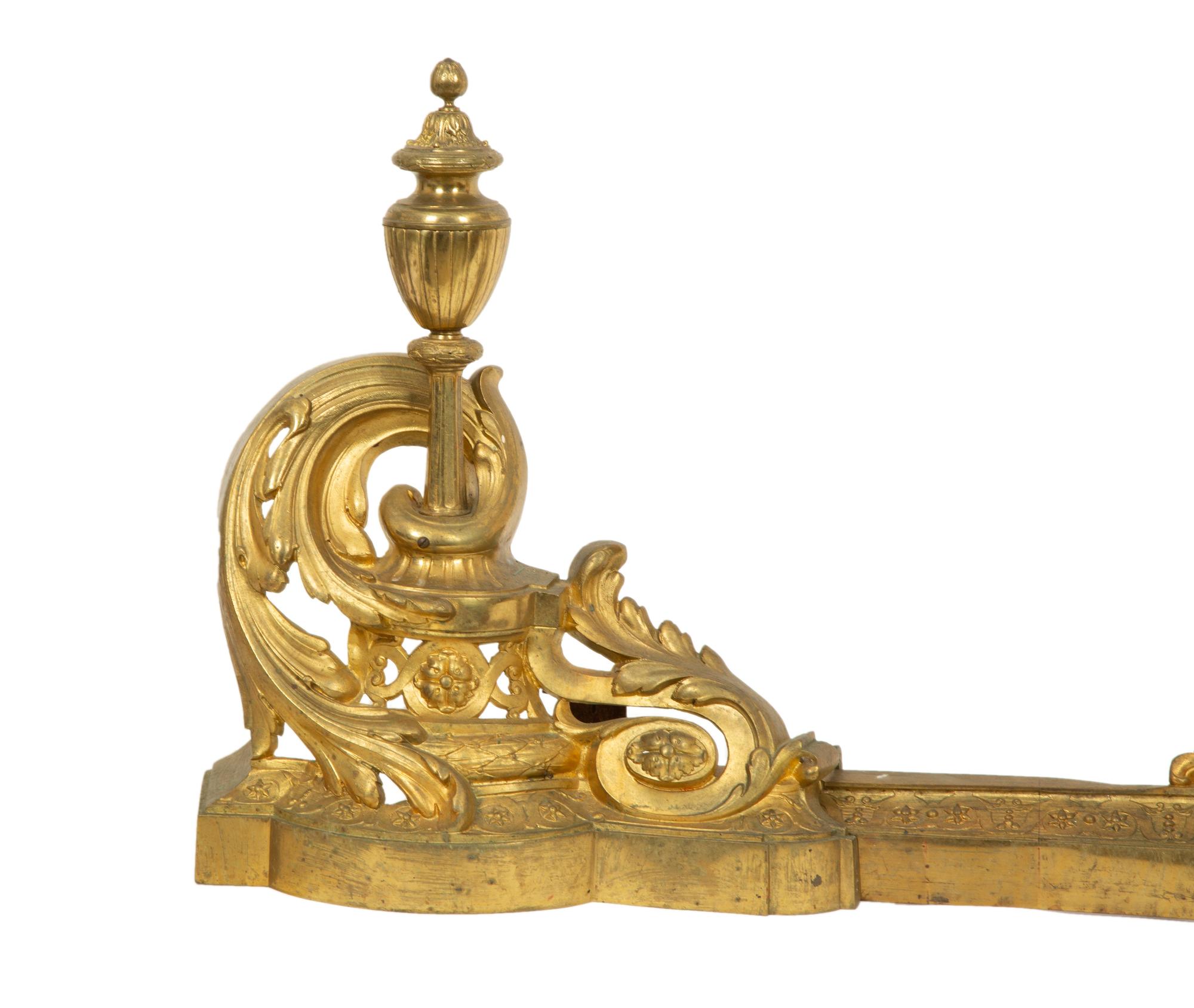 A Pair of Louis XV Style Gilt Bronze Chenets and Fender