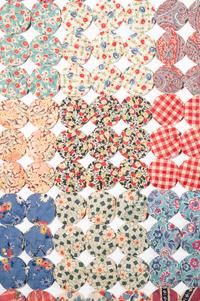A Pieced Cotton Yo-Yo Quilt