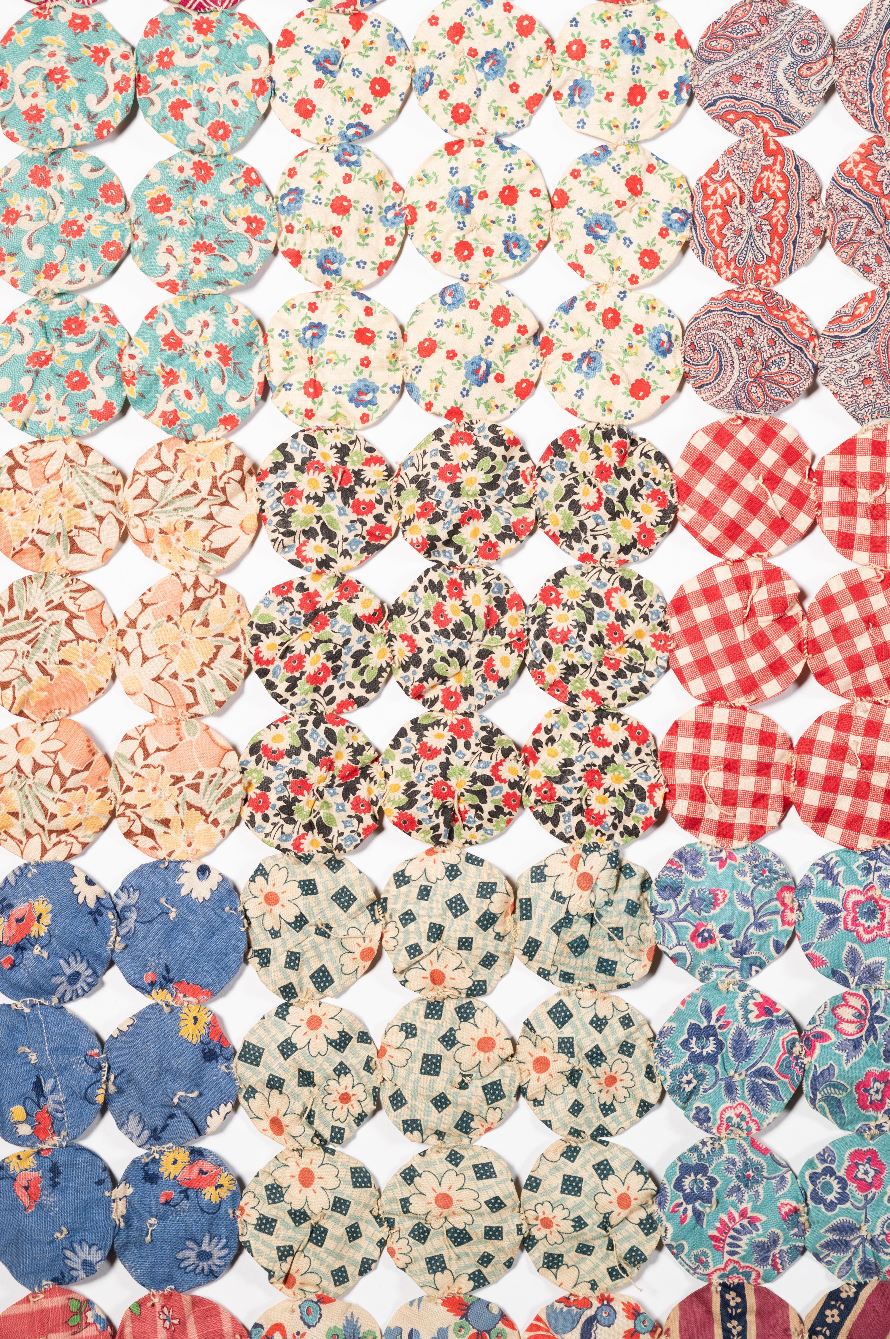 A Pieced Cotton Yo-Yo Quilt