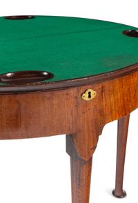 A George I Walnut Demilune Game Table