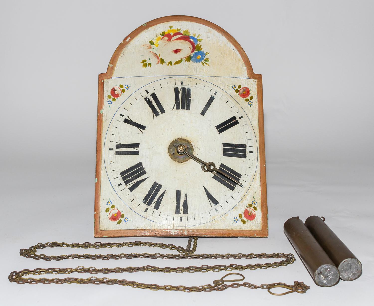 A Dutch Painted Wall Clock. Length 13 1/2 inches.