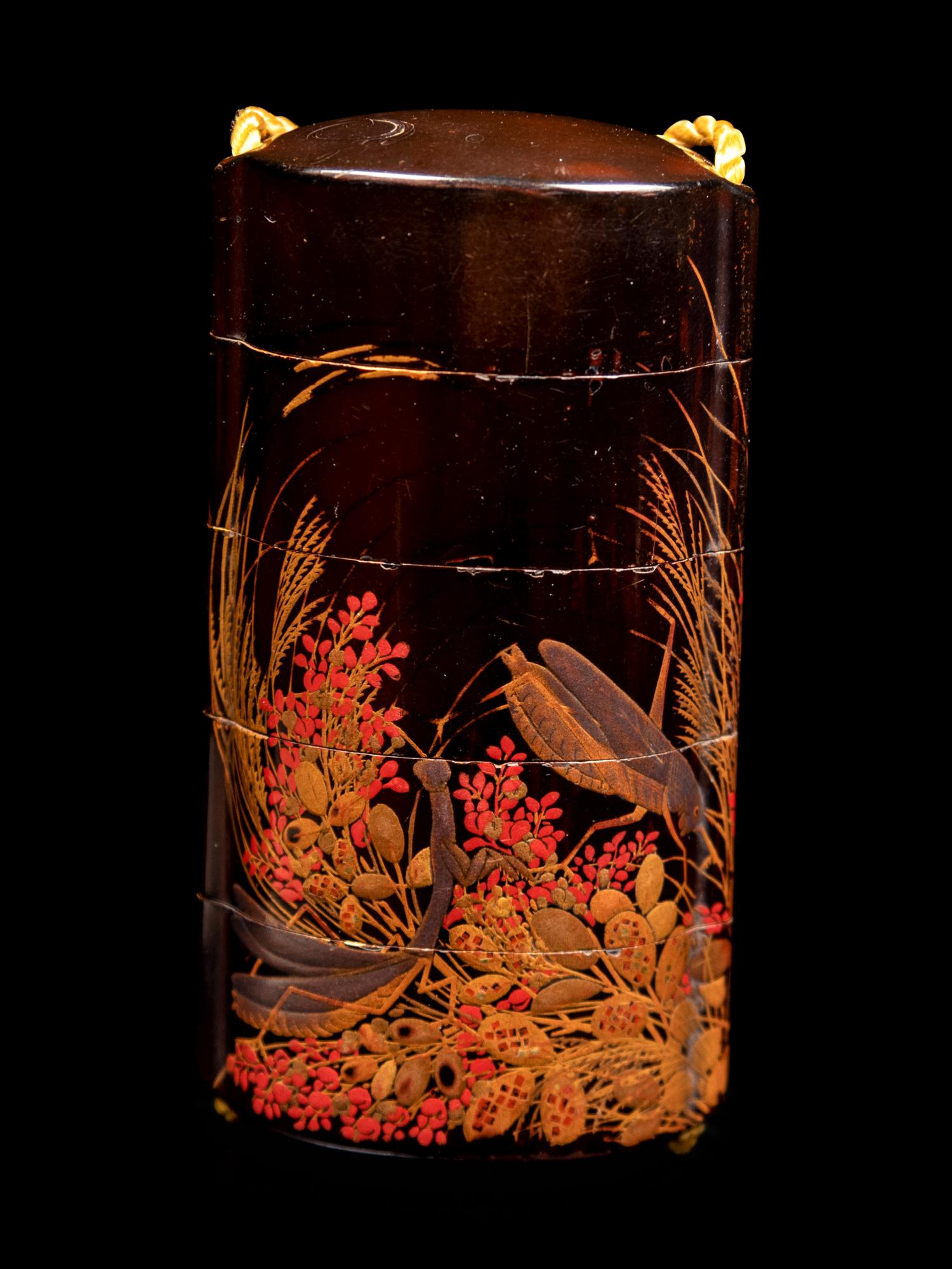 A Gold and Black Lacquer Four-Case Inro