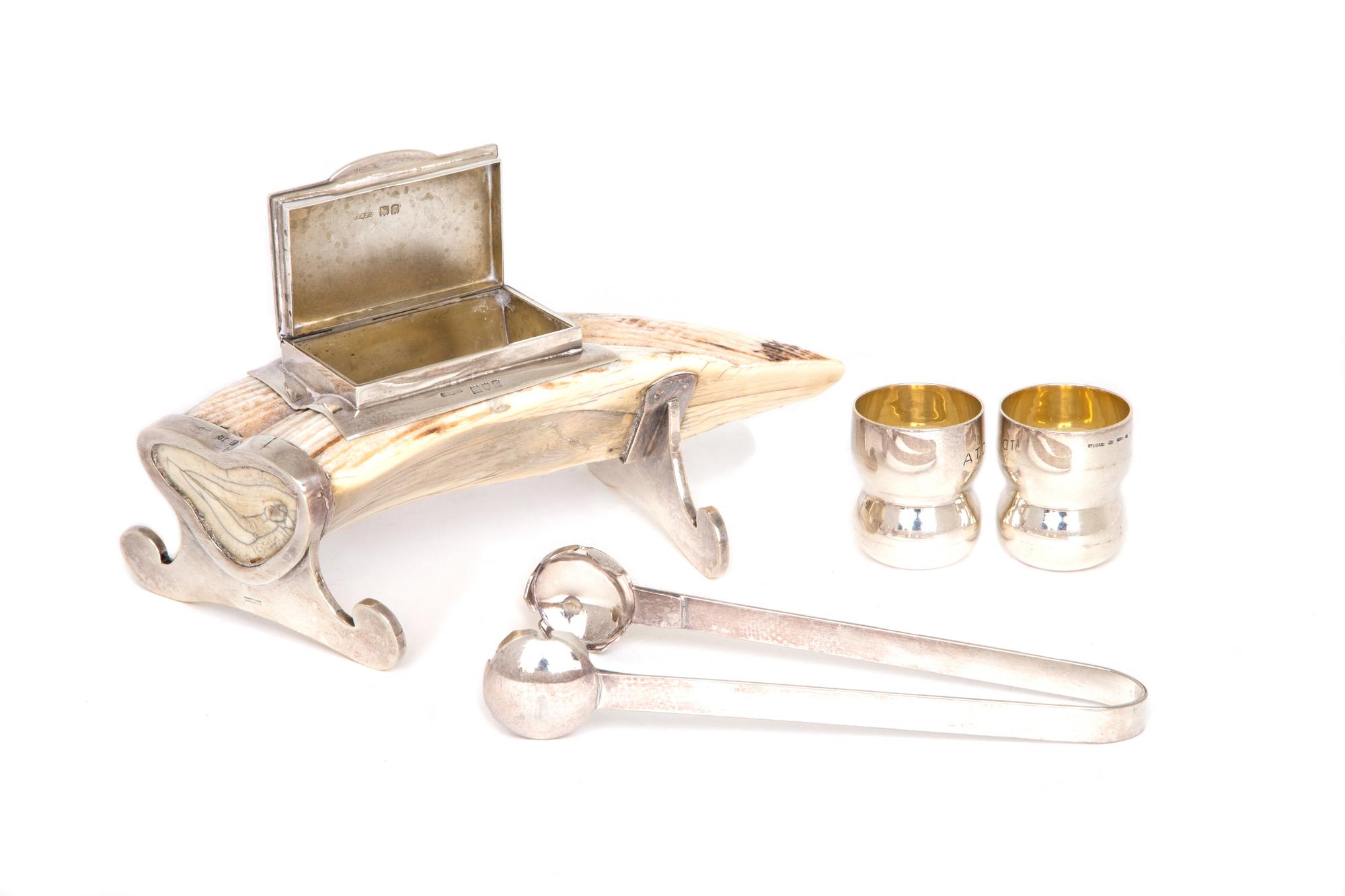 An English Silver Mounted Tusk , A. Barrett & Sons, London , together with a pair of Bulgari silver jiggers and a pair of Napier silver