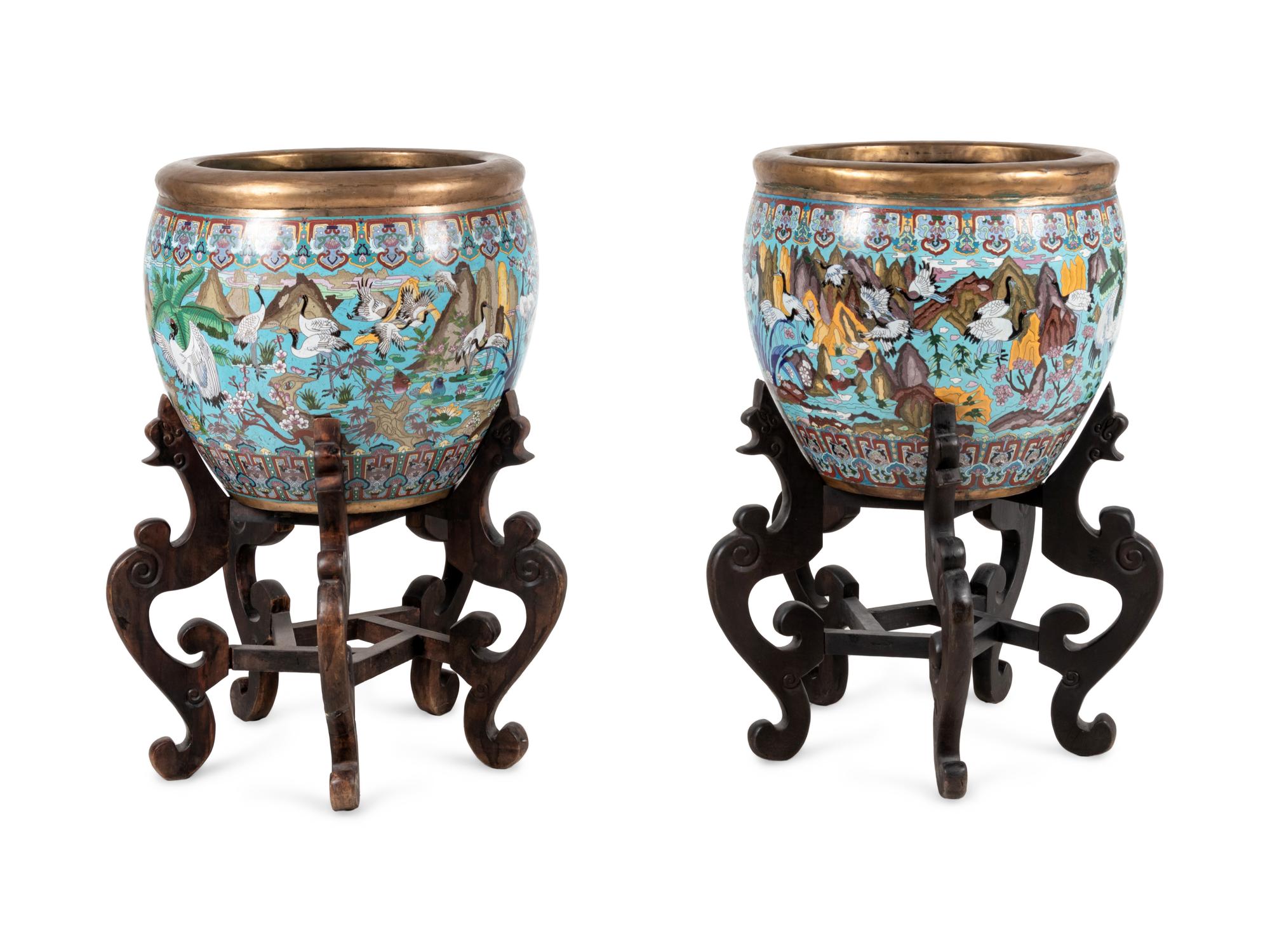 A Pair of Chinese Cloisonné Urns on Wood Stands