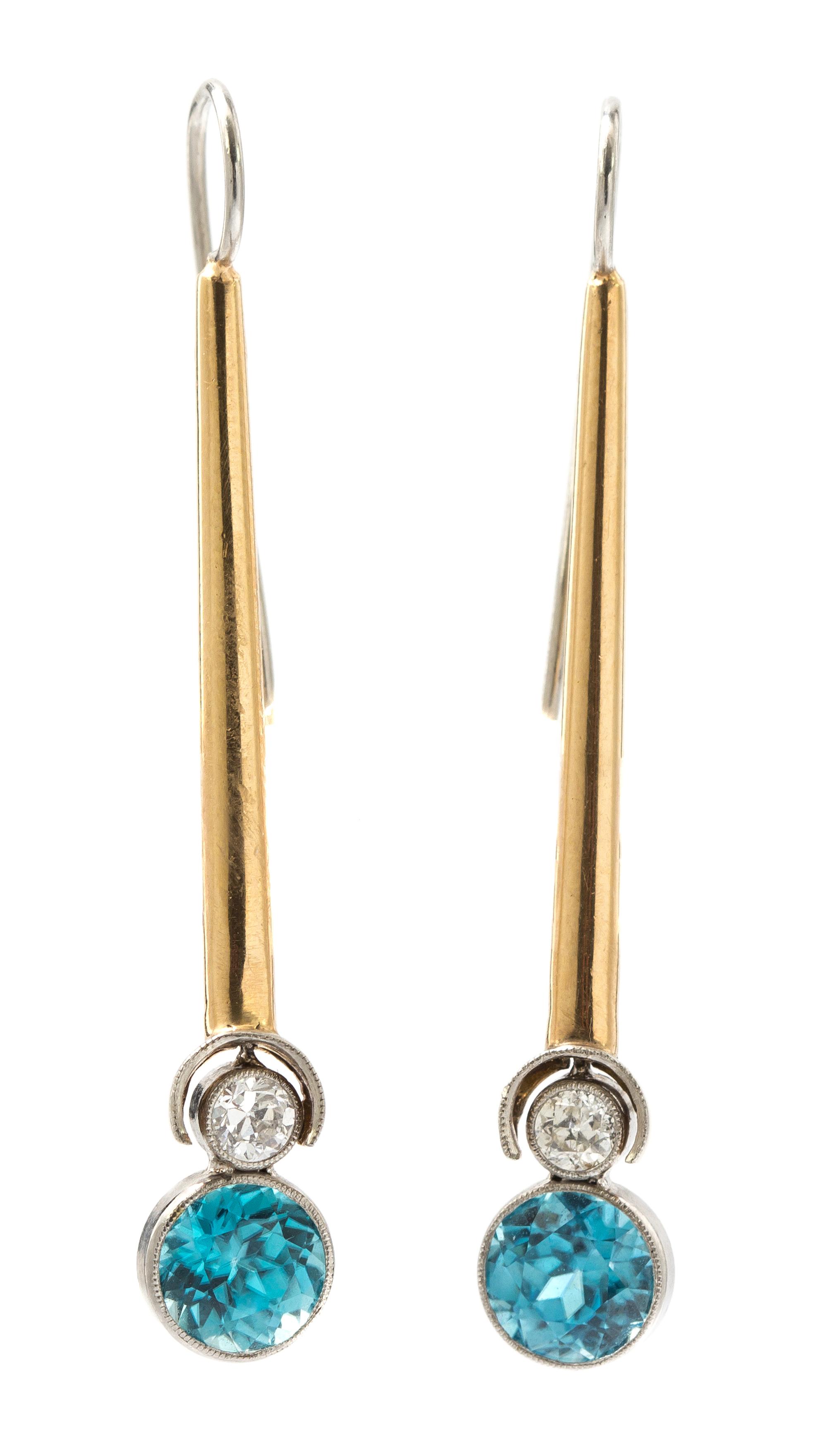 A Pair of Platinum, Gold, Blue Zircon, and Diamond Pendant Earrings, 4.40 dwts.