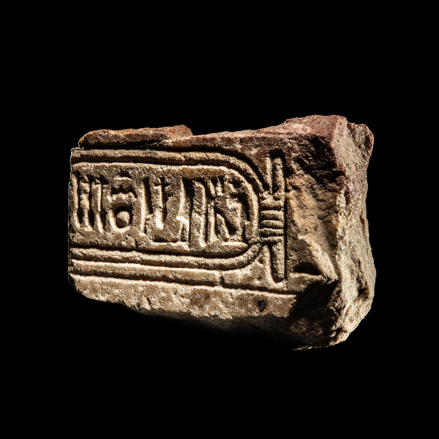 An Egyptian Limestone Fragment with Cartouche of Queen Nefertiti