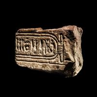 An Egyptian Limestone Fragment with Cartouche of Queen Nefertiti