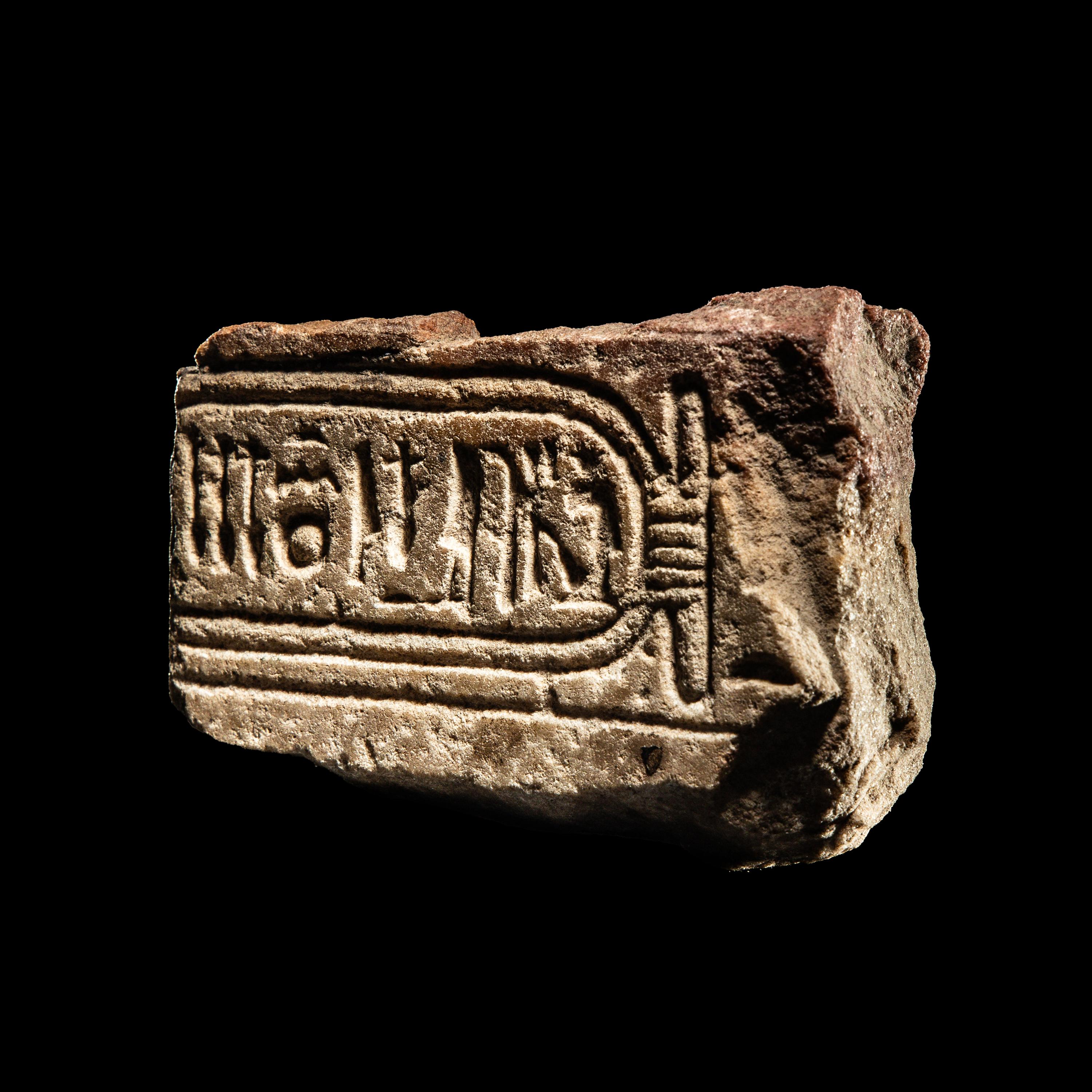 An Egyptian Limestone Fragment with Cartouche of Queen Nefertiti