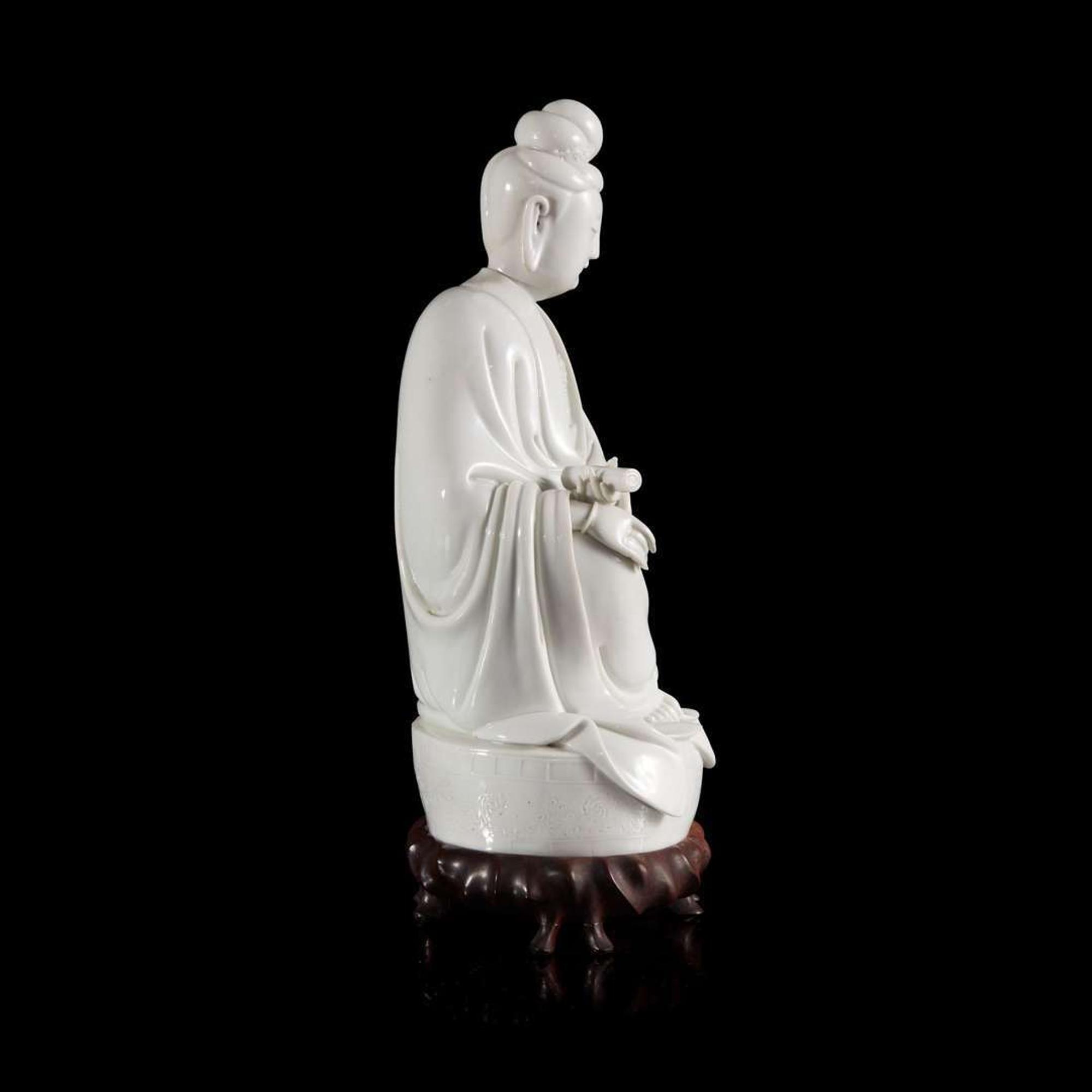 A Chinese blanc de chine figure of Guanyin 德化窑观音造像 "Dehua" and "Puji Yuren" mark ”??“ ? “????” ??